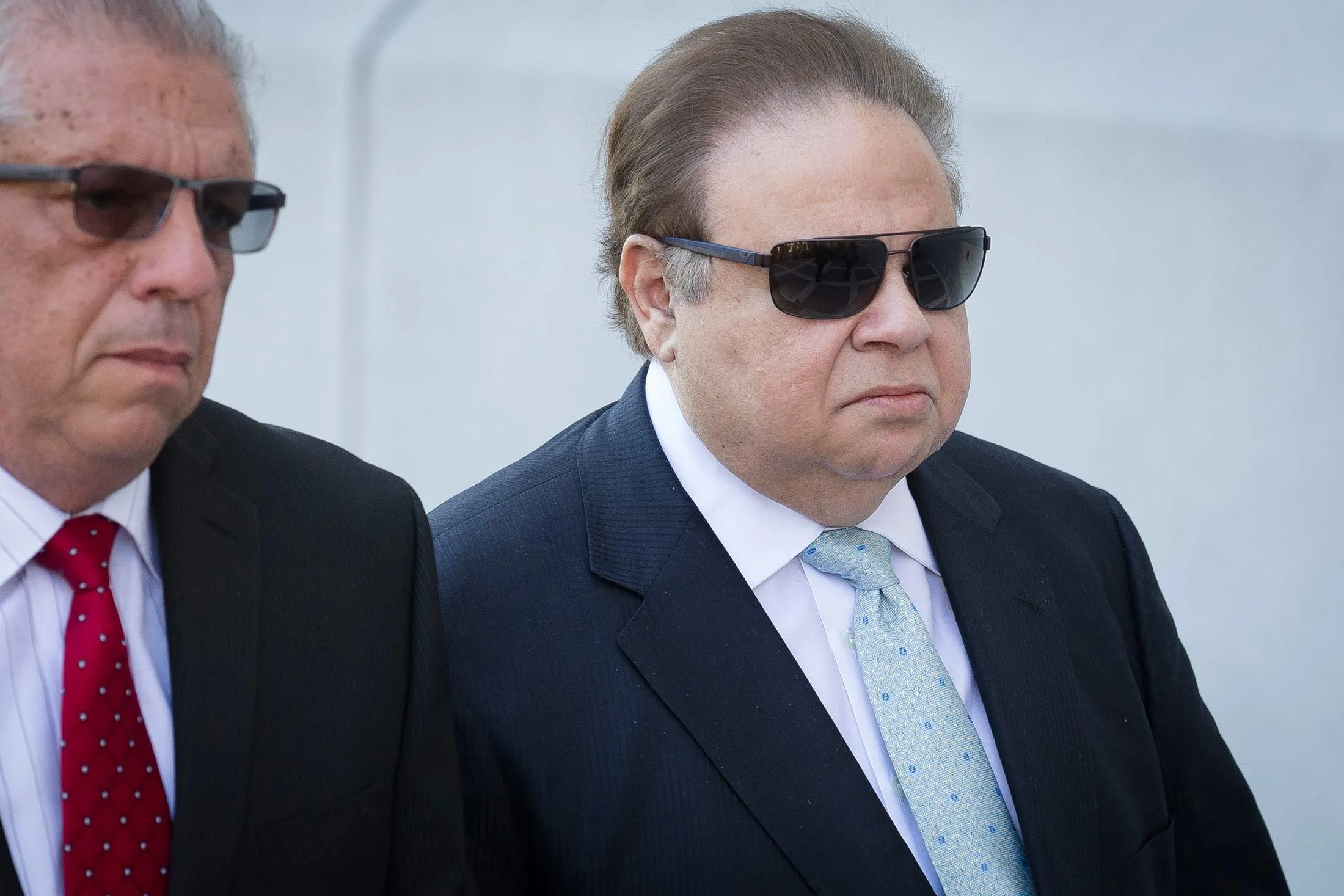 Salomon Melgen, right, arrives at Newark Federal Court on April 2, 2015, in Newark, N.J.
