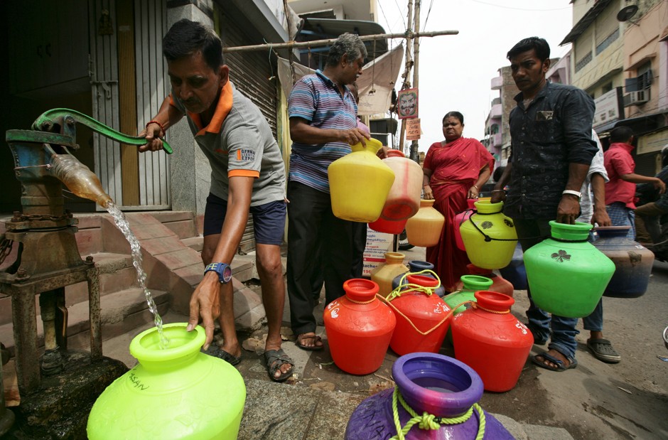 A man pumps drinking water during the water shortage in Chennai, India.