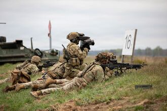 US soldiers conduct a live-fire during a field training exercise near Bemowo Piskie Training Area, Poland, in May.