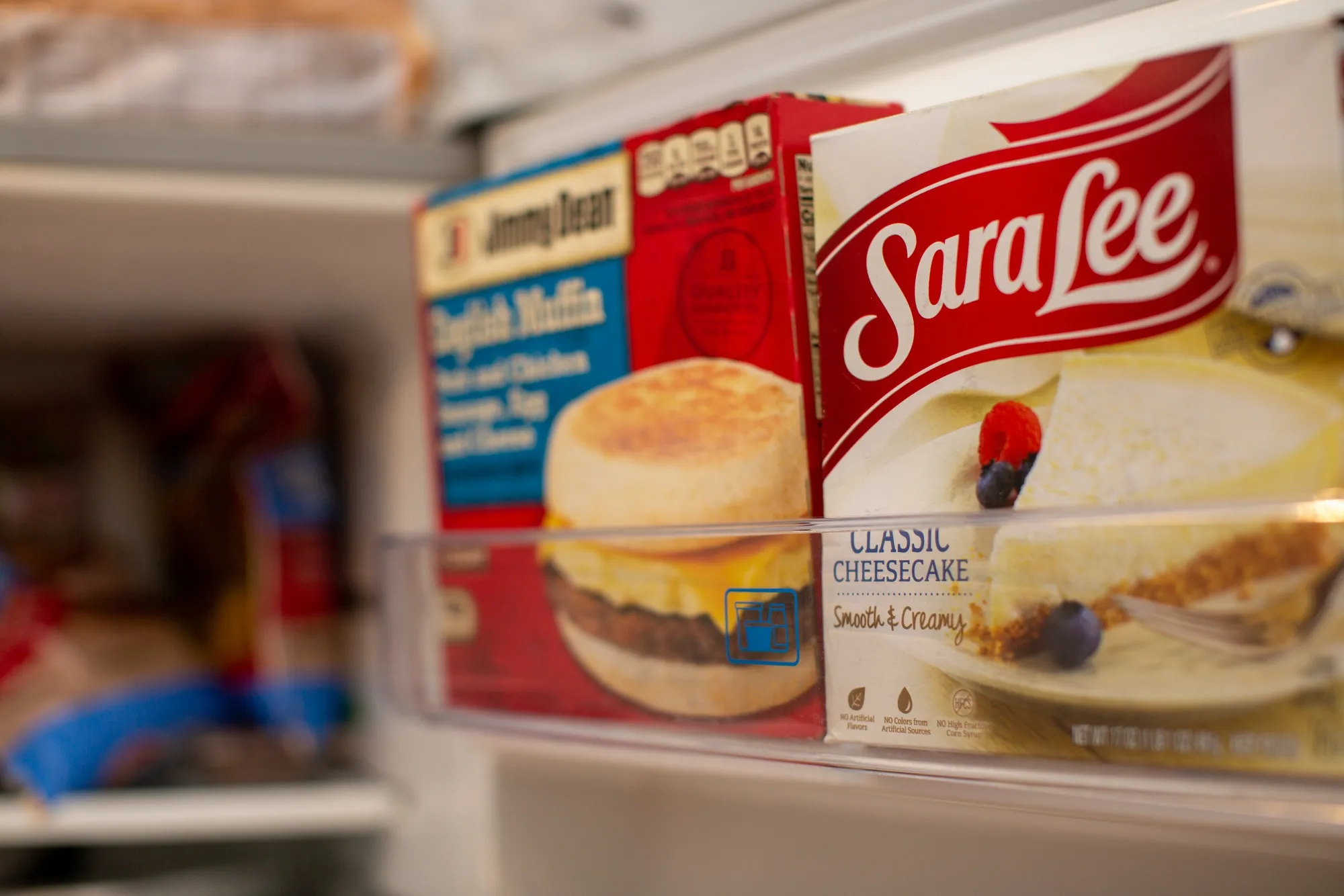 A package of Tyson Foods Sara Lee brand cheesecake and Jimmy Dean English Muffin breakfast sandwiches.