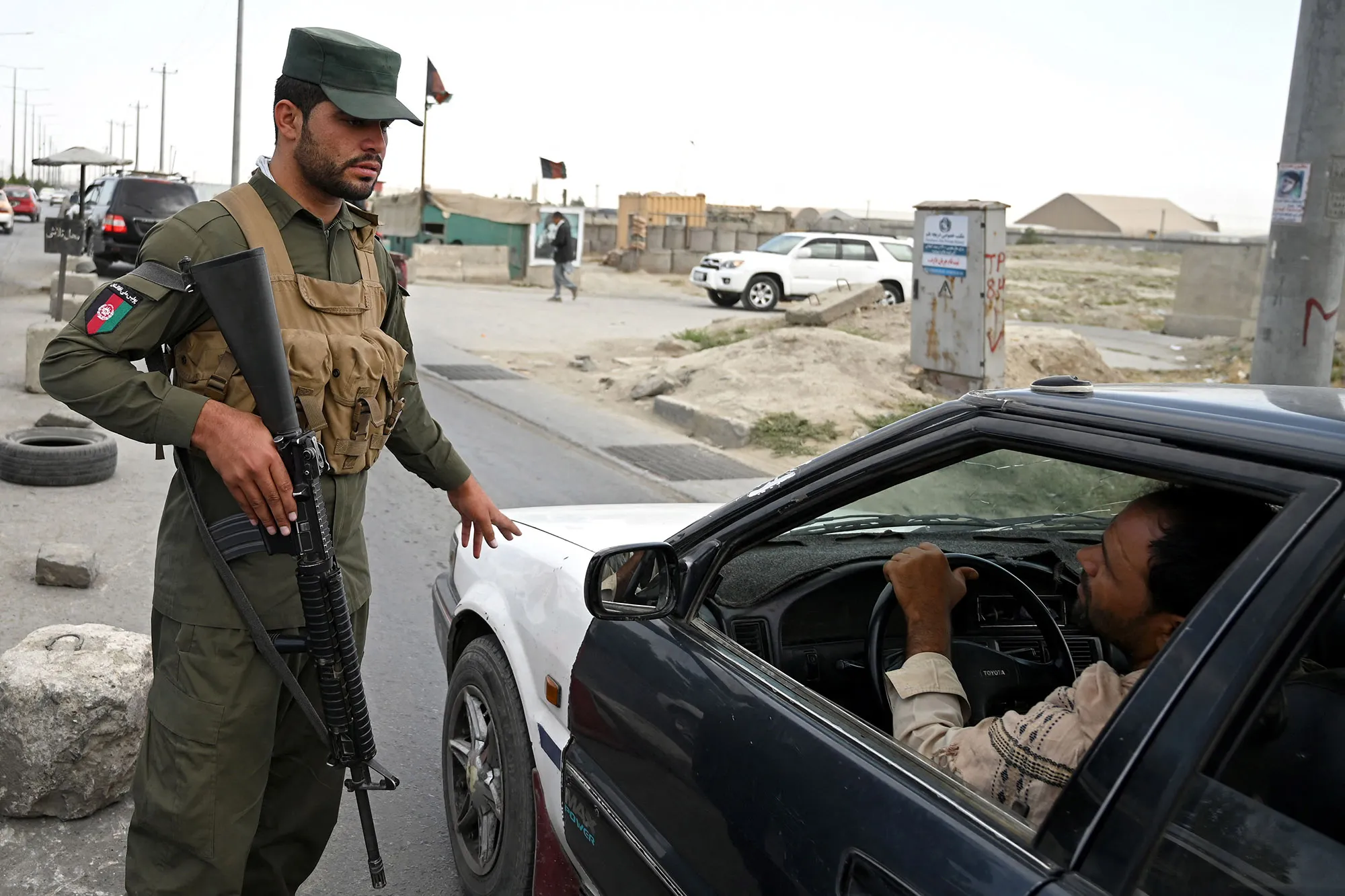 An Afghan policeman at a Kabul checkpoint on Aug. 14.