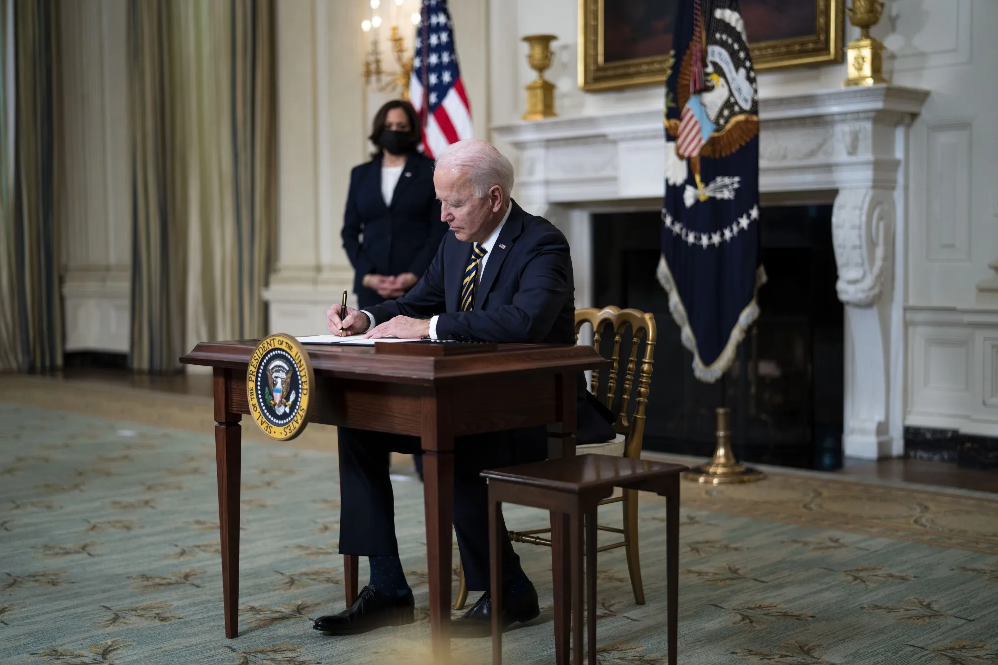 Biden Revokes Trump Orders on Financial Regulation, Immigration - Bloomberg