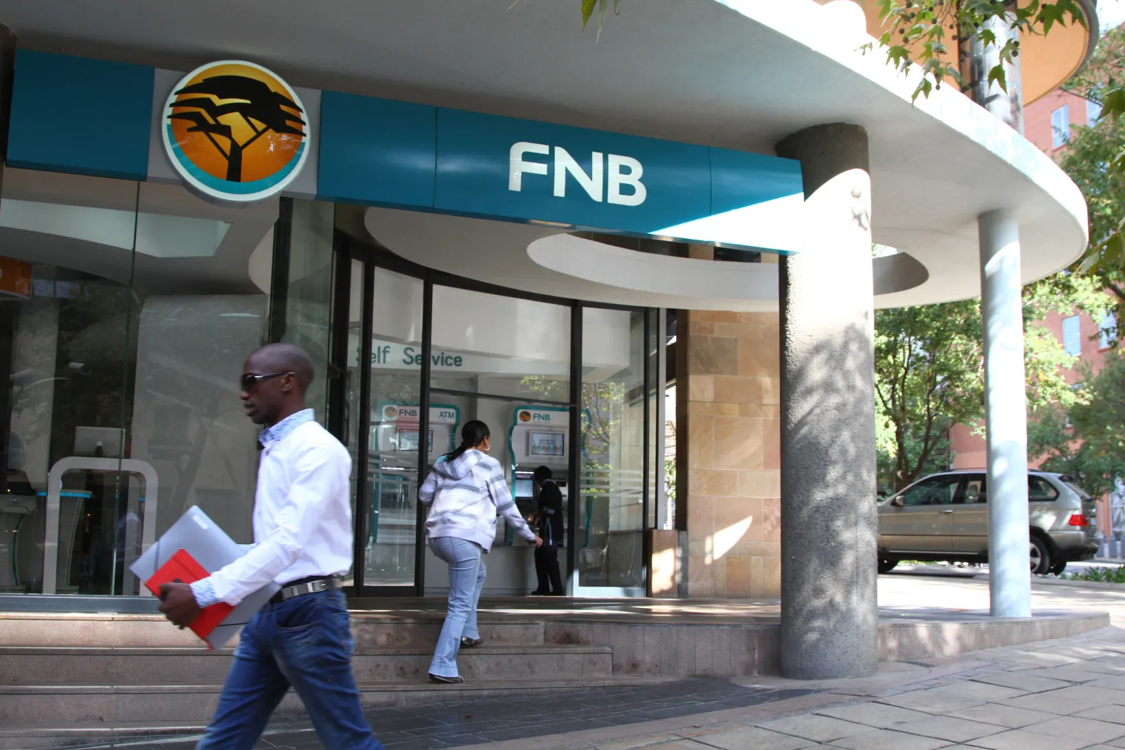 A customer enters a First National Bank branch in Johannesburg.