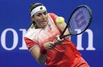 Ons Jabeur, of Tunisia, returns a shot to Caroline Garcia, of France, during the semifinals of the U.S. Open tennis championships, Thursday, Sept. 8, 2022, in New York. (AP Photo/Frank Franklin II)