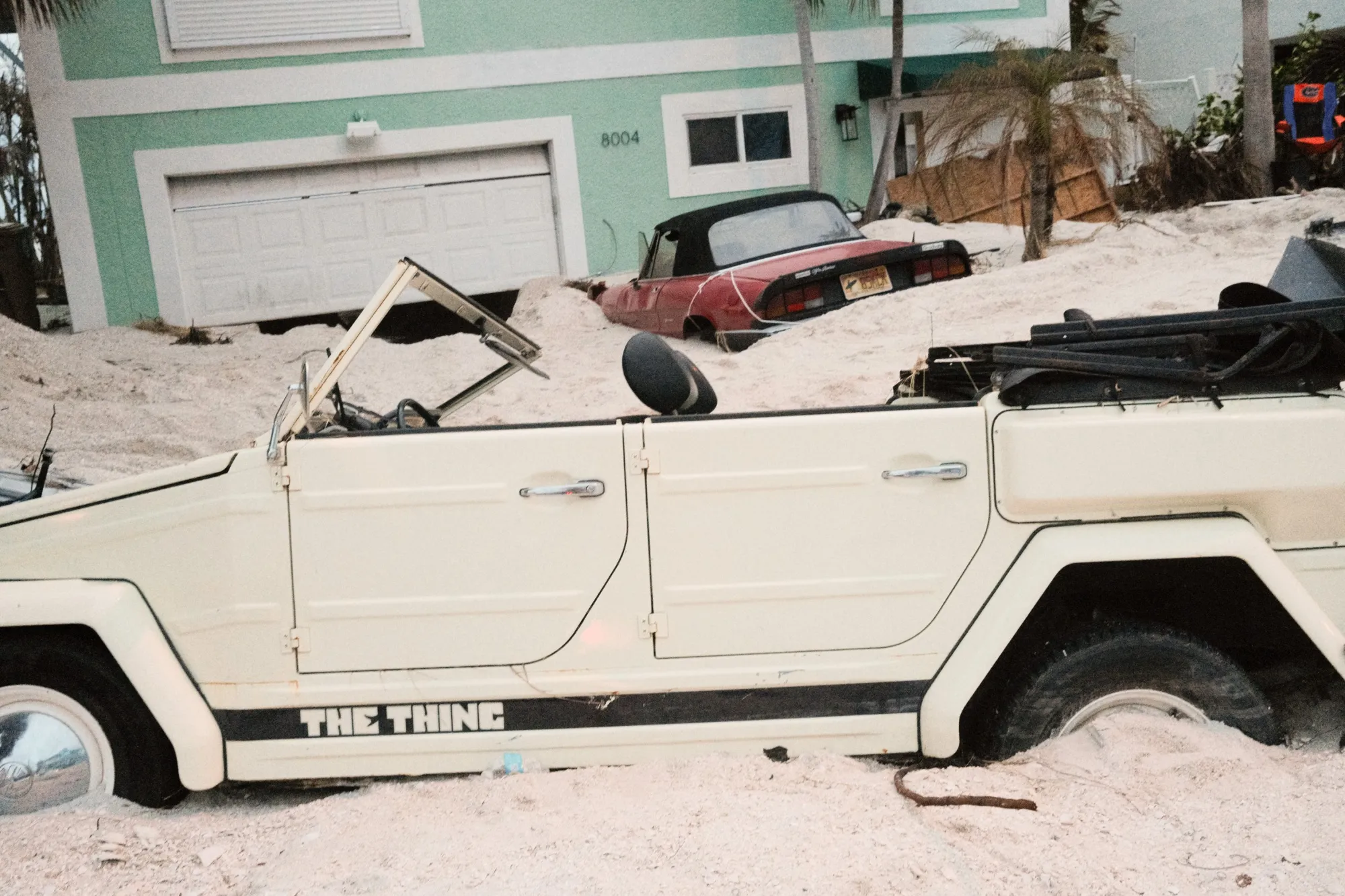 Vehicles stuck in sand swept up by Hurricane Helene last year.