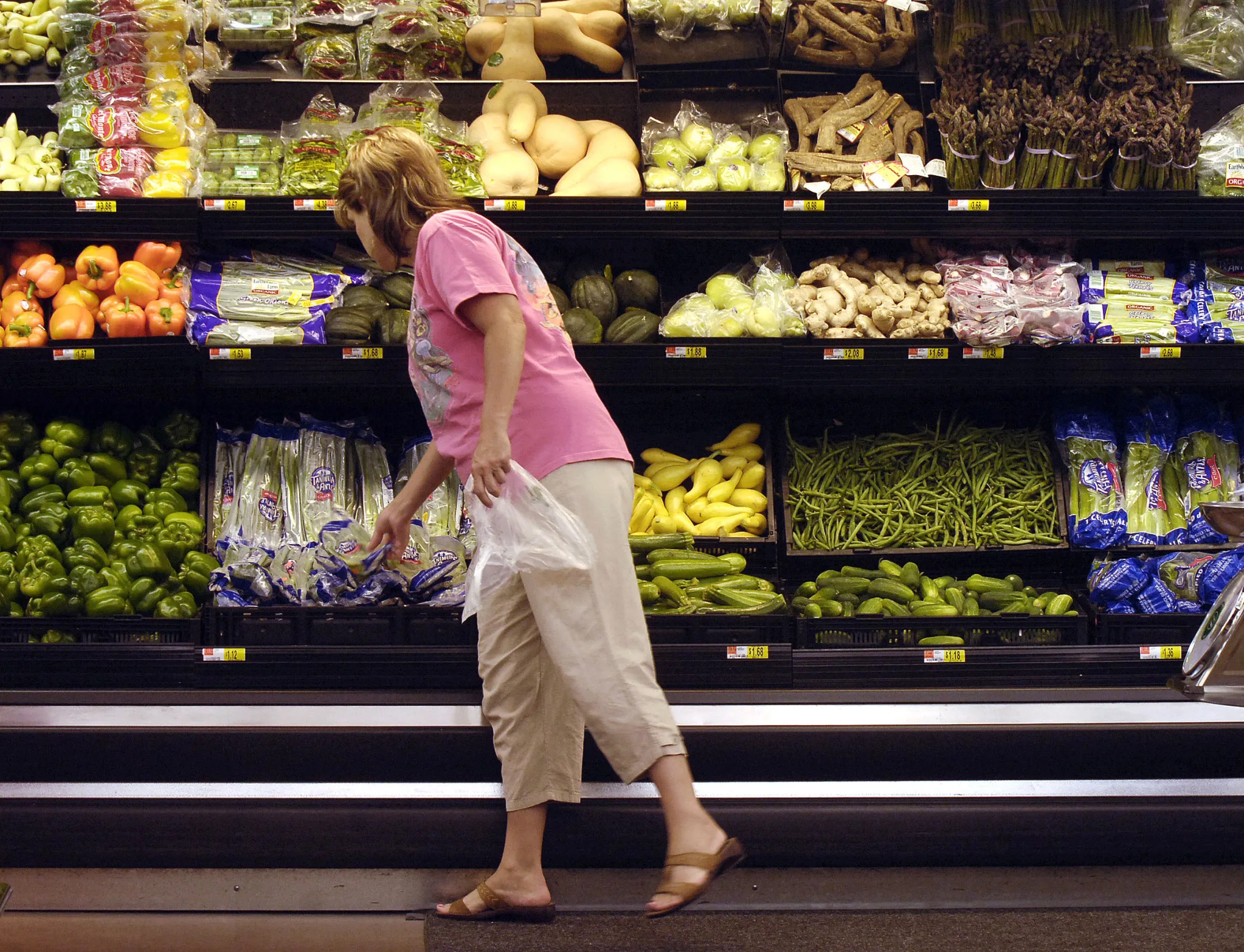 A shopper looks at produce at a Wal-Mart store in Rogers, Arkansas.