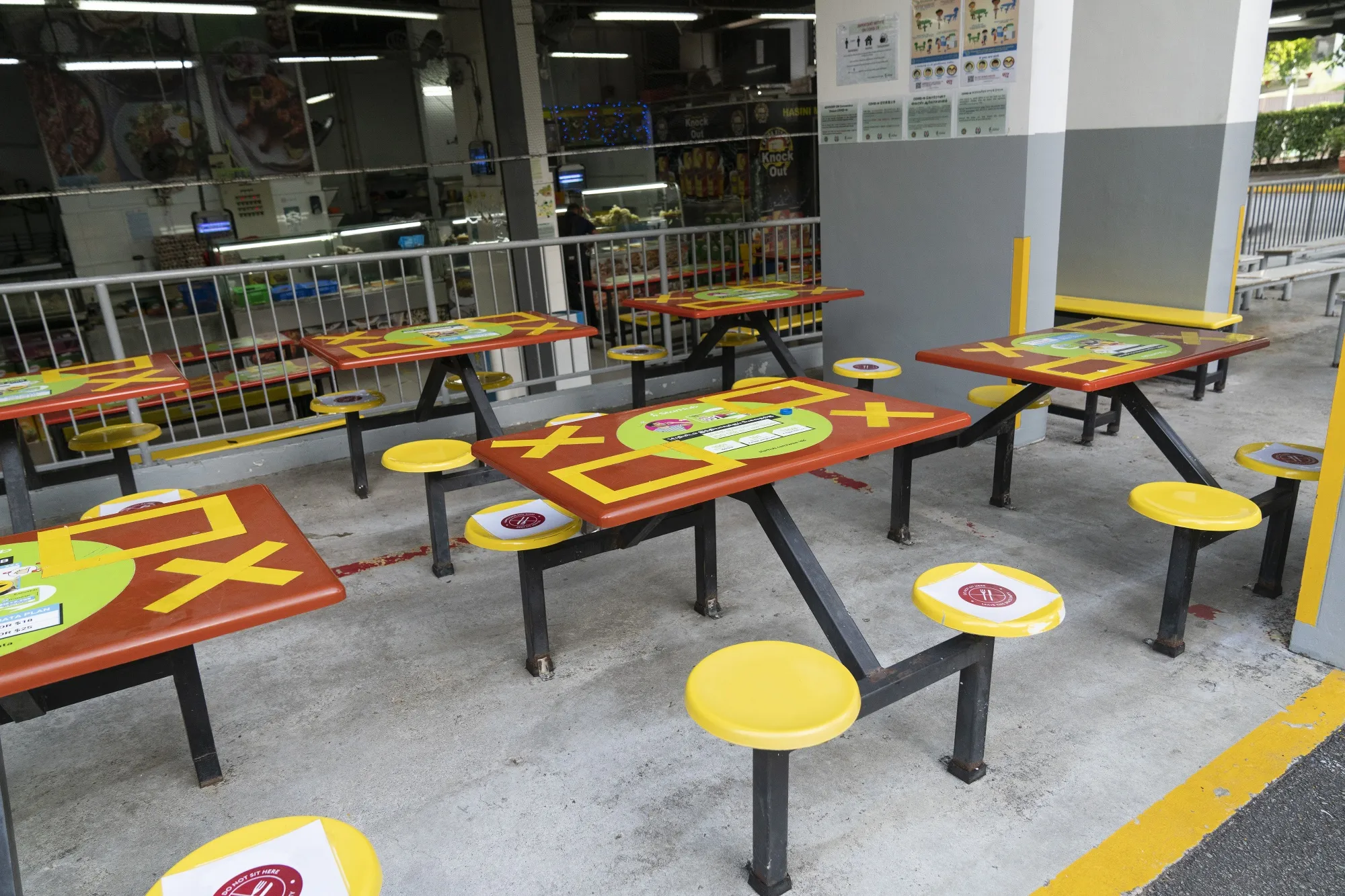 Social distancing markers in the canteen of a workers dormitory in Singapore.