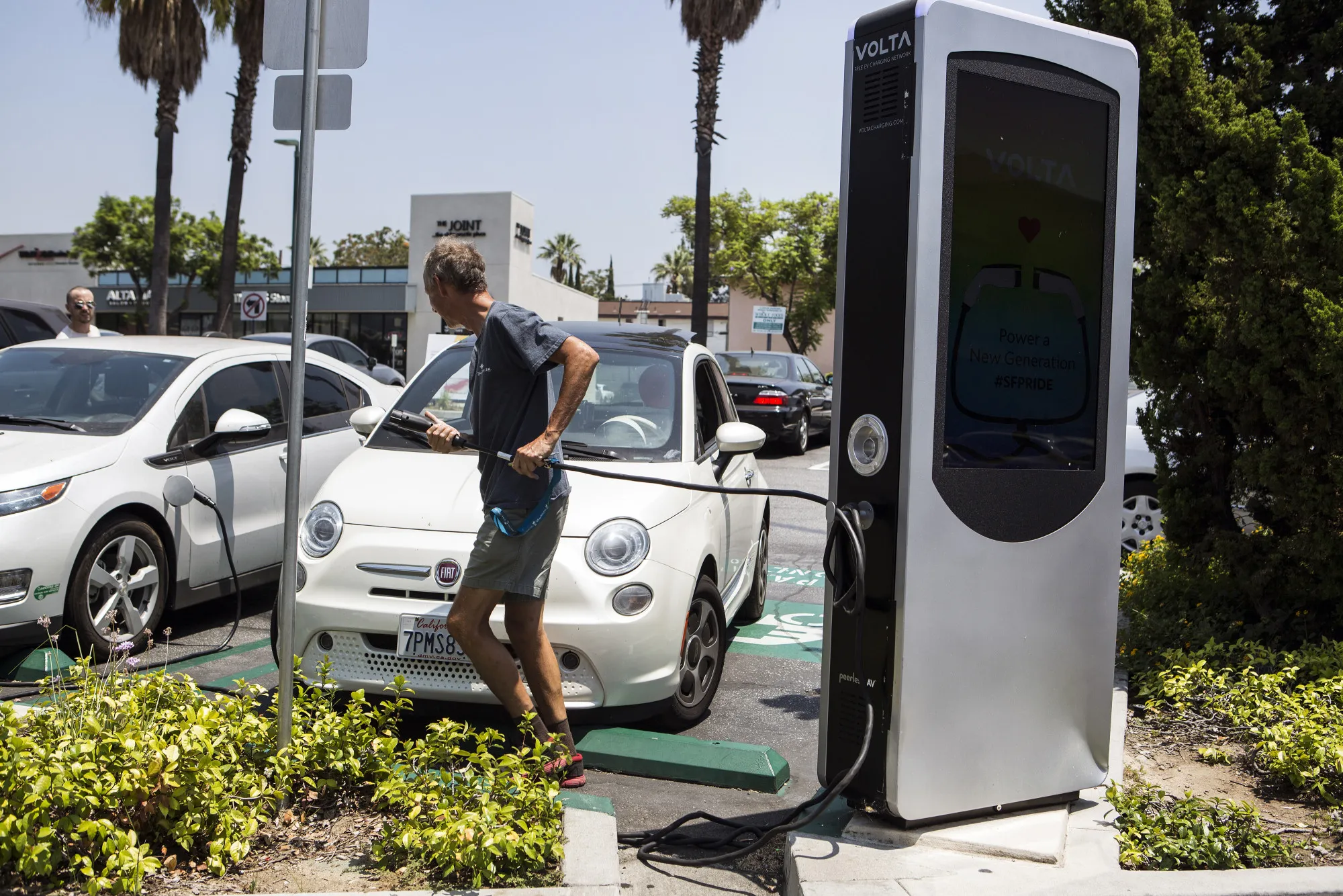 Drivers charge electric vehicles&nbsp;at an electric charging station in Los Angeles, California.