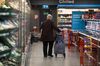 A shopper pulls a trolley along a chilled and frozen goods aisle, during a time set aside for elderly and vulnerable members of the community to shop, at an Iceland Foods Ltd. store in London, U.K.