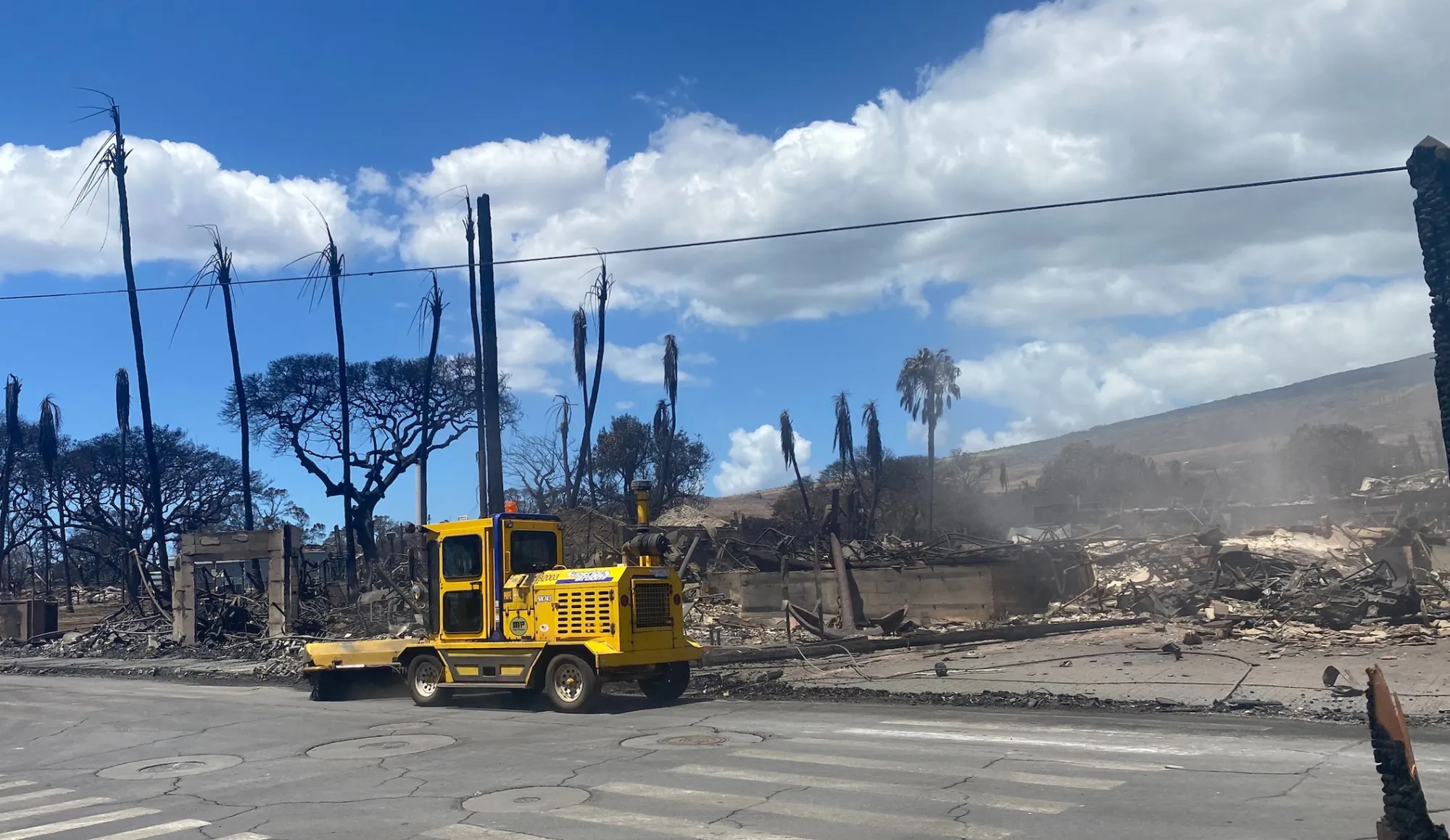 Destroyed buildings and homes in the aftermath of a wildfire in Lahaina.