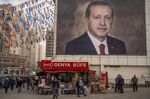A street kiosk in front of a mural of Turkish President Recep Erdogan in Bursa, Turkey, on Jan. 4.&nbsp;