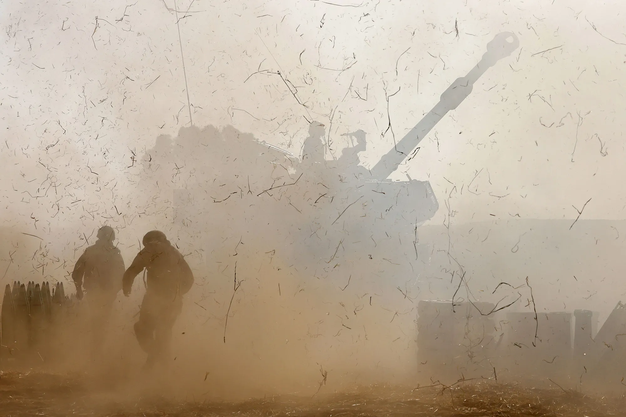 Israeli soldiers fire a 155mm self-propelled howitzer towards the Gaza Strip from their position near the southern Israeli city of Sderot on May 12.