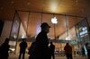 People walk past an Apple store in Beijing on October 19, 2020. (Photo by GREG BAKER / AFP) (Photo by GREG BAKER/AFP via Getty Images)