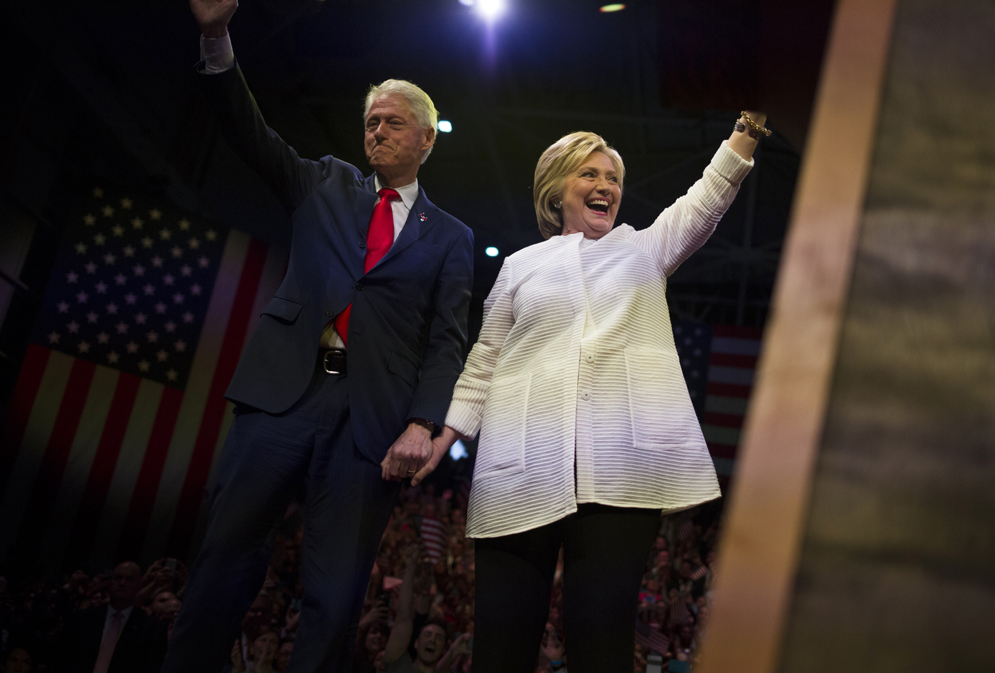 Hillary and Bill Clinton wave to supporters during a primary night event at the Brooklyn Navy Yard in the Brooklyn borough of New York, on June 7, 2016.
