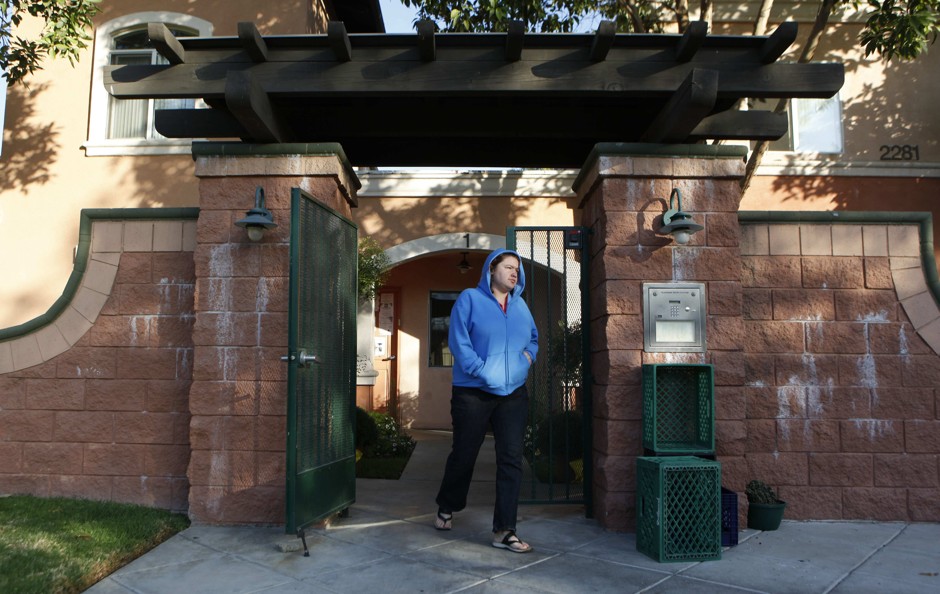 A homeless Iraq war veteran walks out of a shelter in Long Beach in 2009.