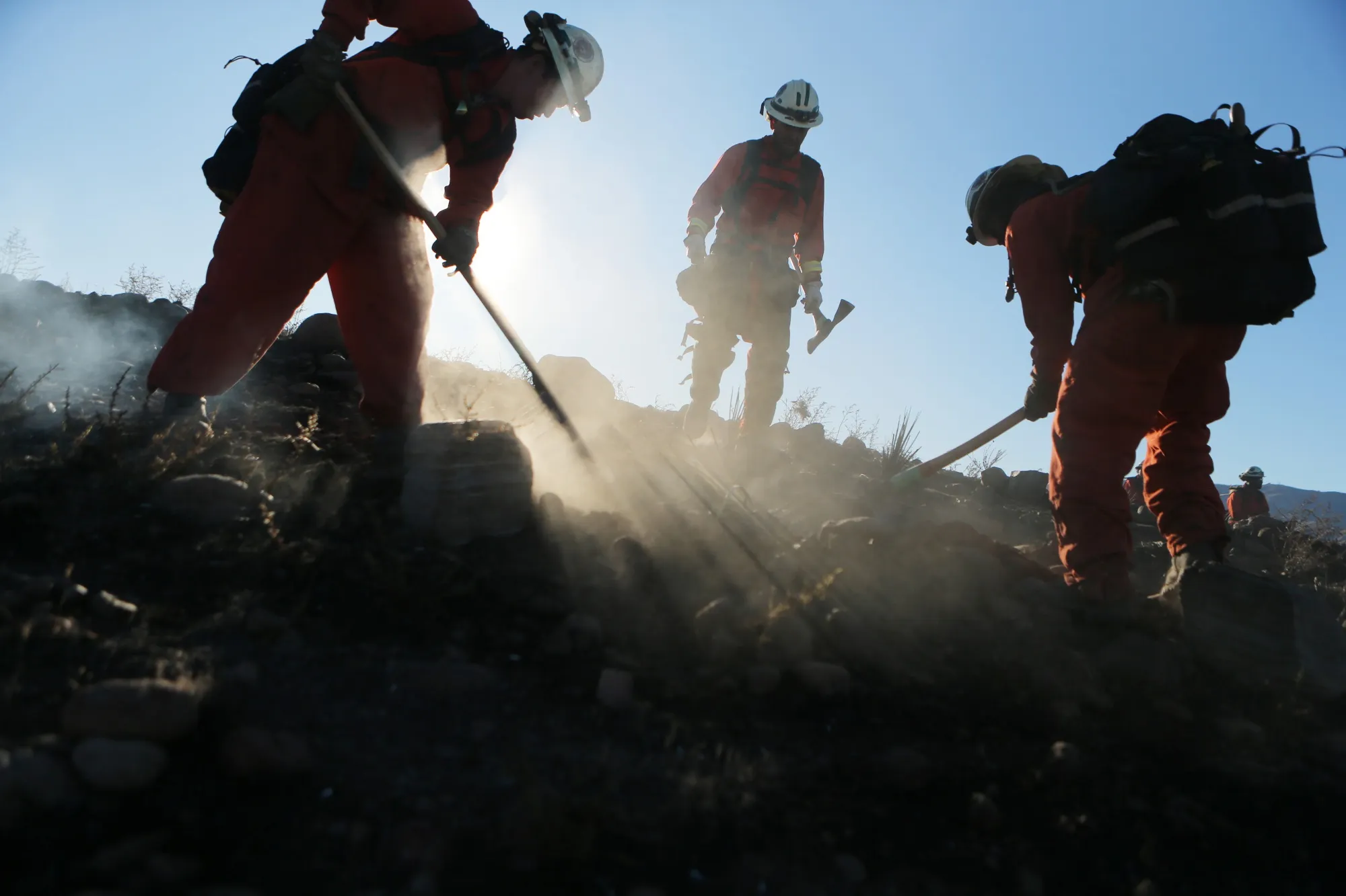 Firefighters&nbsp;put out hot spots from the Tick Fire&nbsp;in Canyon Country, California on Oct. 25.