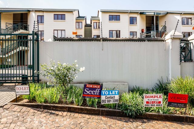 Rental advertisements outside a housing complex in Johannesburg.