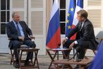 Vladimir Putin and&nbsp;Emmanuel Macron during a meeting at the Fort de Bregancon, a summer residence of the president of France, on the French Riviera on Aug. 19.&nbsp;