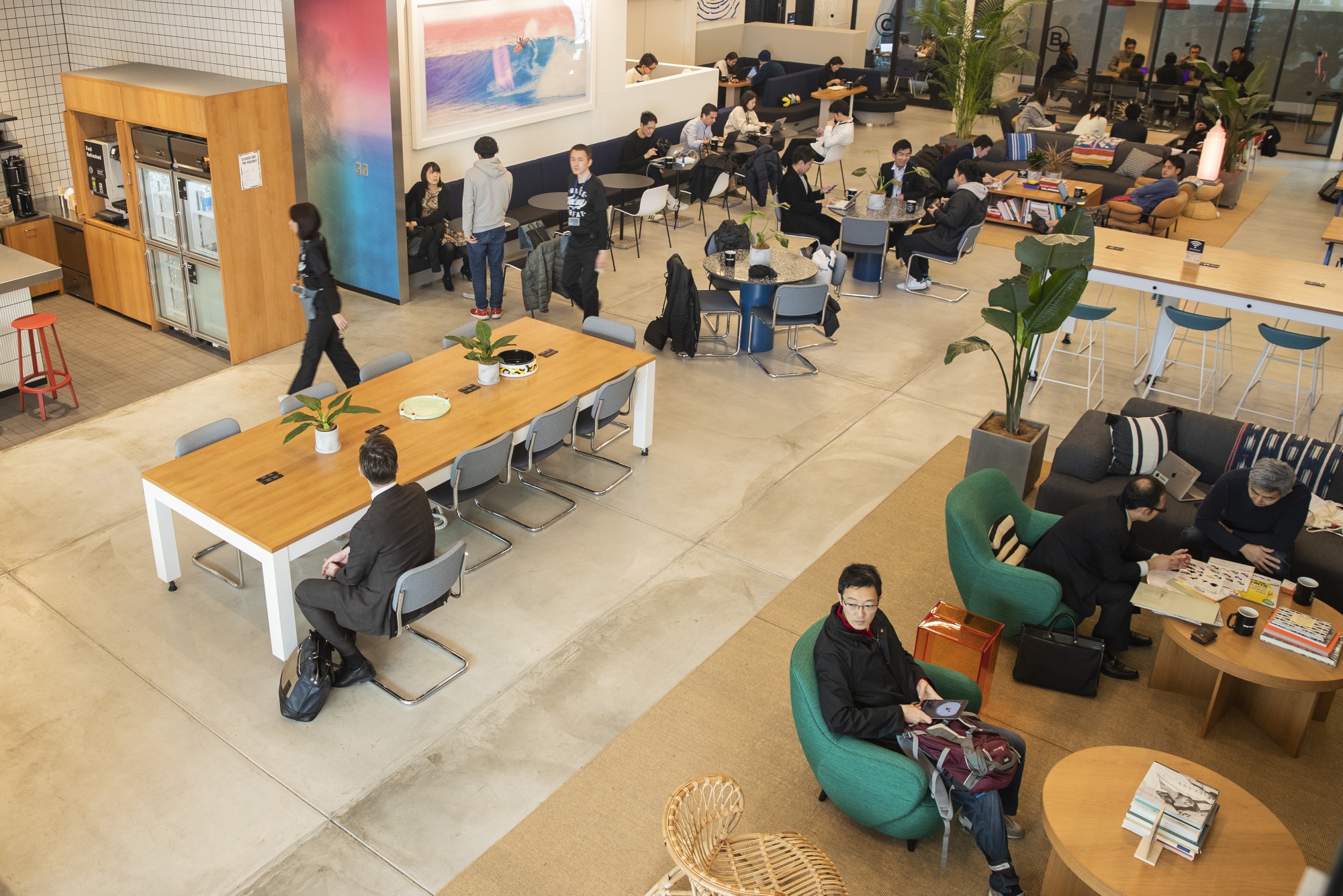 Members sit at the WeWork&nbsp;co-working space in Tokyo.