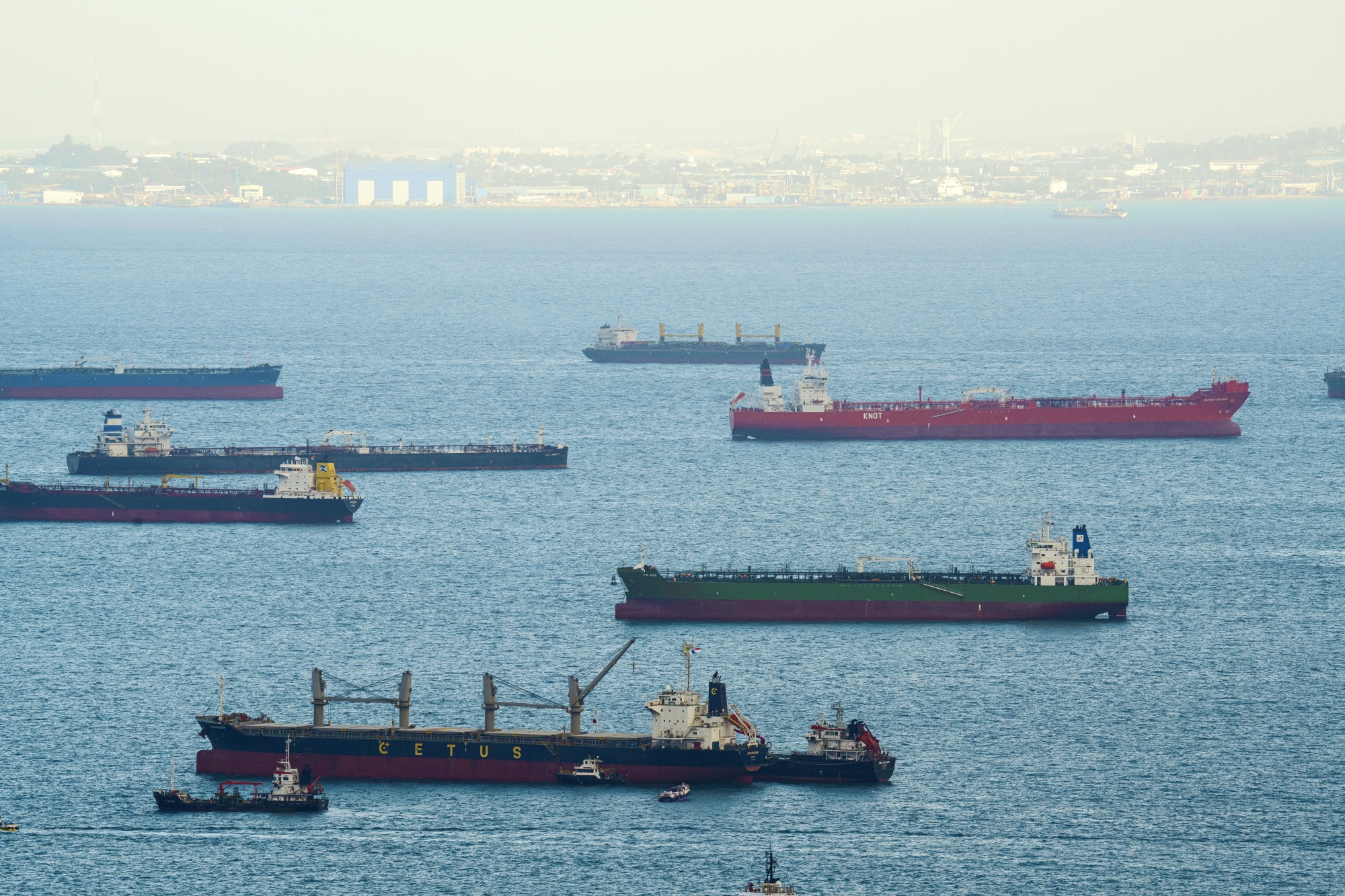 Oil tankers and cargo ships off the shore of Singapore, on Tuesday, March 17, 2026. A widening conflict in the Middle East has led to dramatic swings and surges in the price of fuel for ships, prompting distributors in Singapore, the world’s top bunkering hub, to cut back their purchases. Photographer: Ore Huiying/Bloomberg