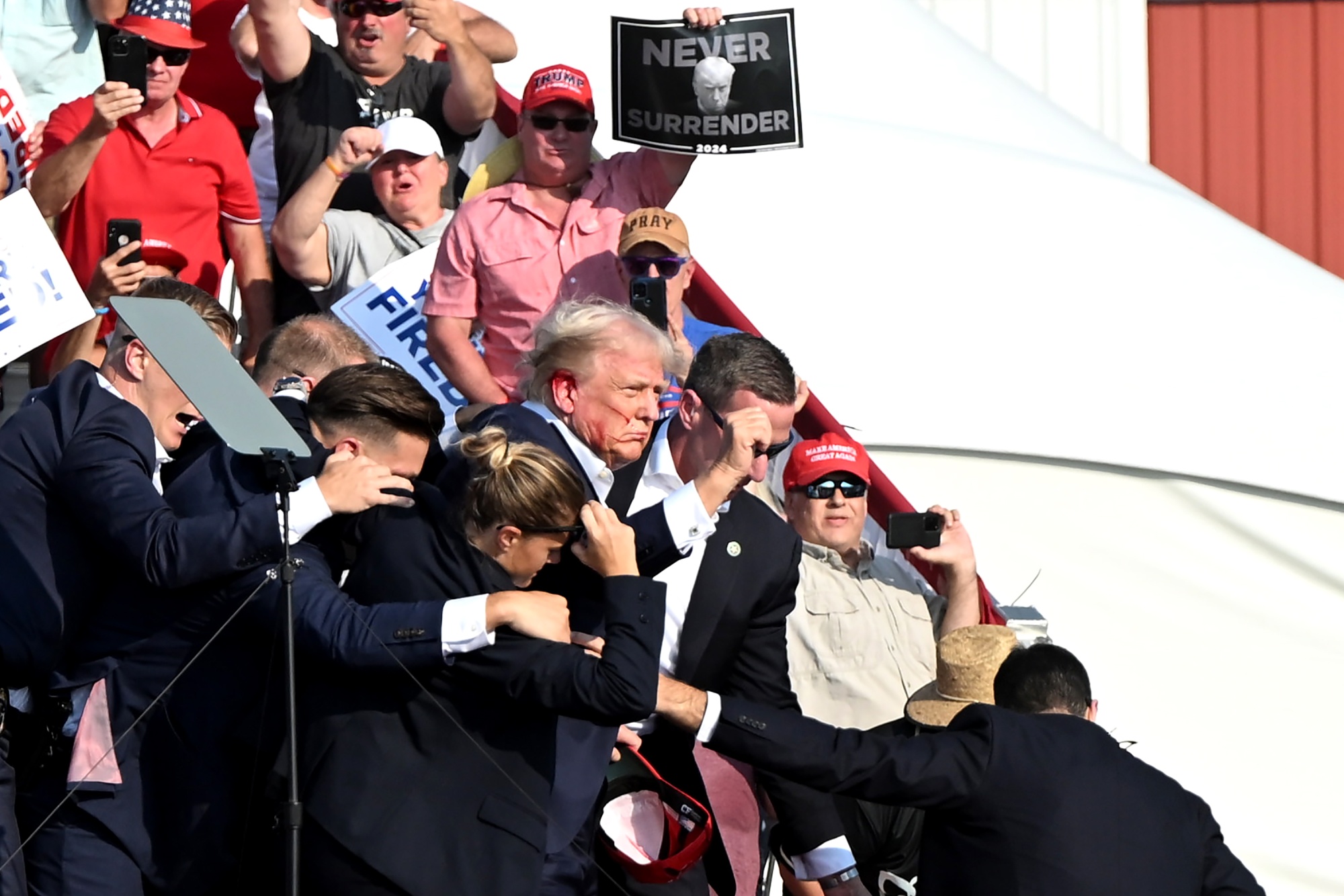 Donald Trump is surrounded by Secret Service agents during a campaign event at Butler Farm Show Inc. in Butler, Pennsylvania, US, on July 13.