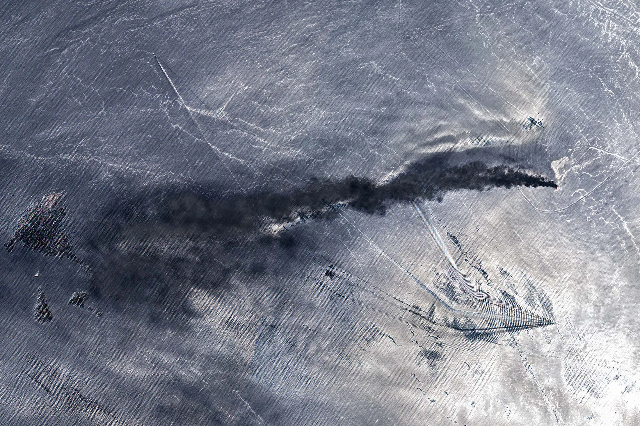 A satellite image of a burning tanker in the Gulf of Oman on June 13.