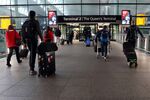Passengers make their way in to terminal 2 at London Heathrow Airport.
