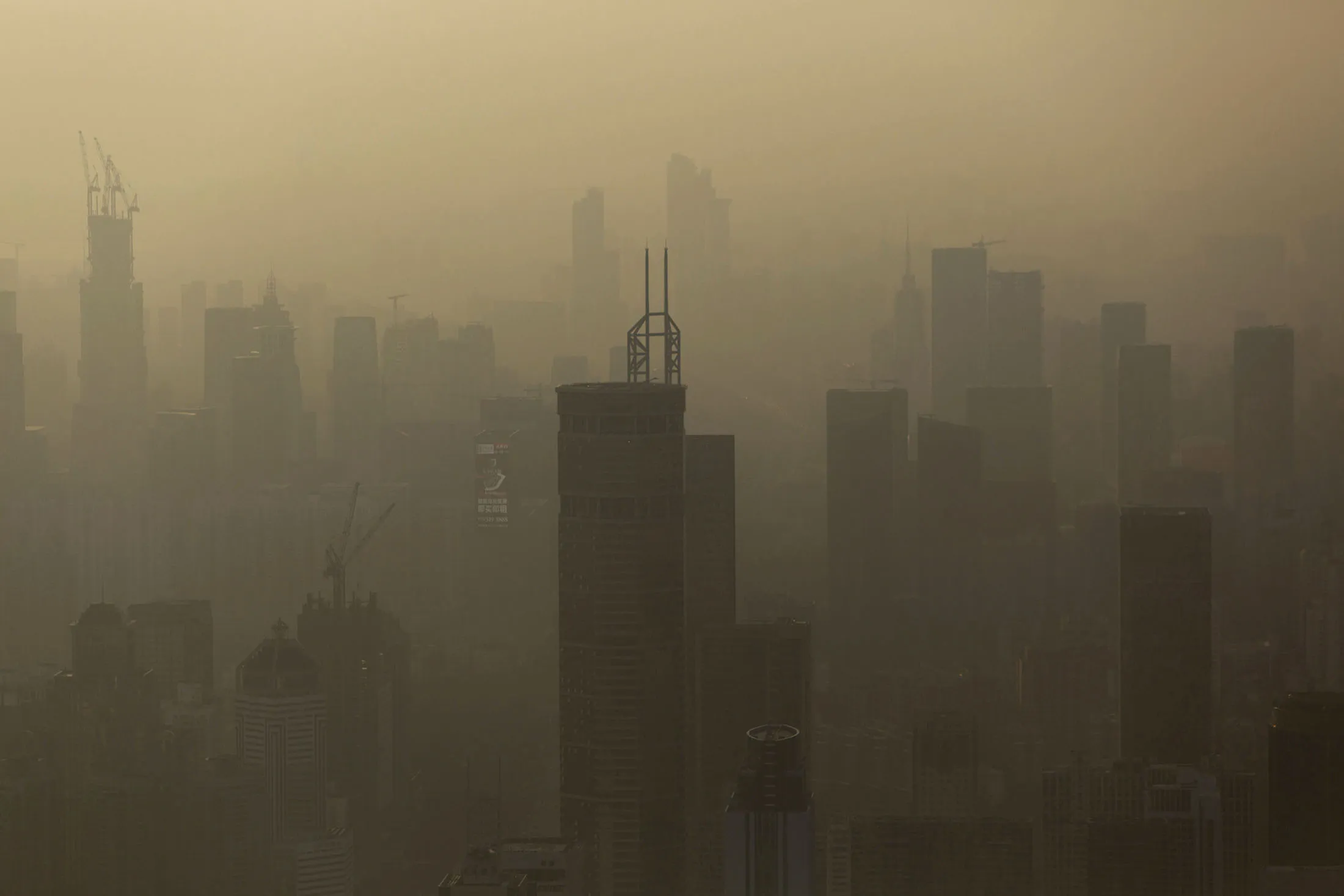 Smog hangs in the air around buildings in the Luohu district of Shenzhen, China.
