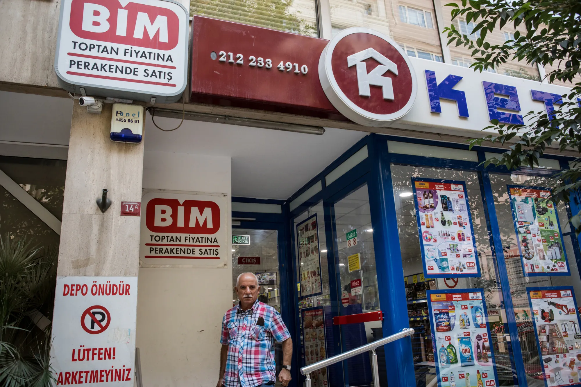 A customer exits a BIM discount supermarket in Istanbul, Turkey.