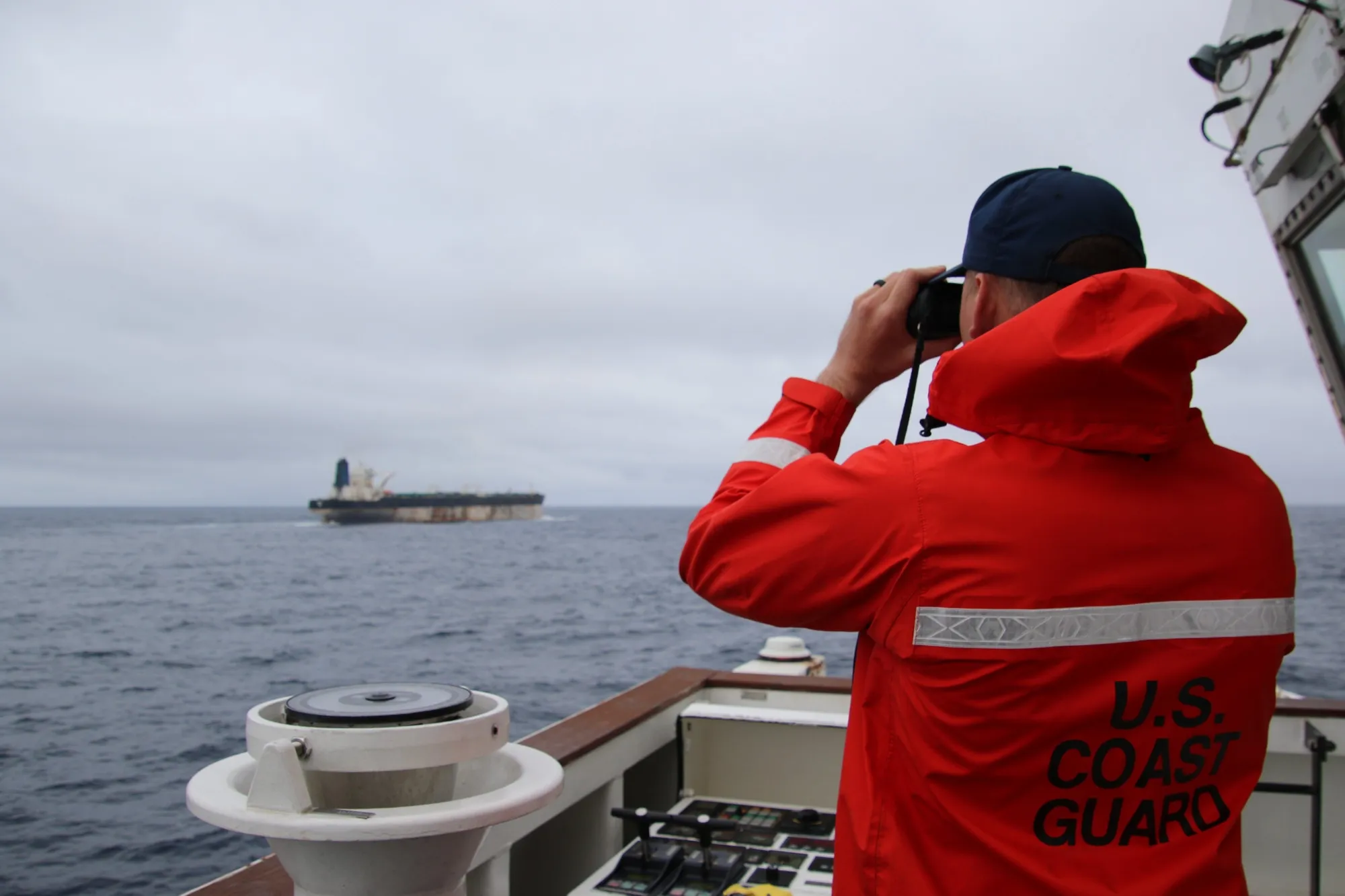 A member of the US Coast Guard looks at the Marinera in this handout image released on Jan. 7