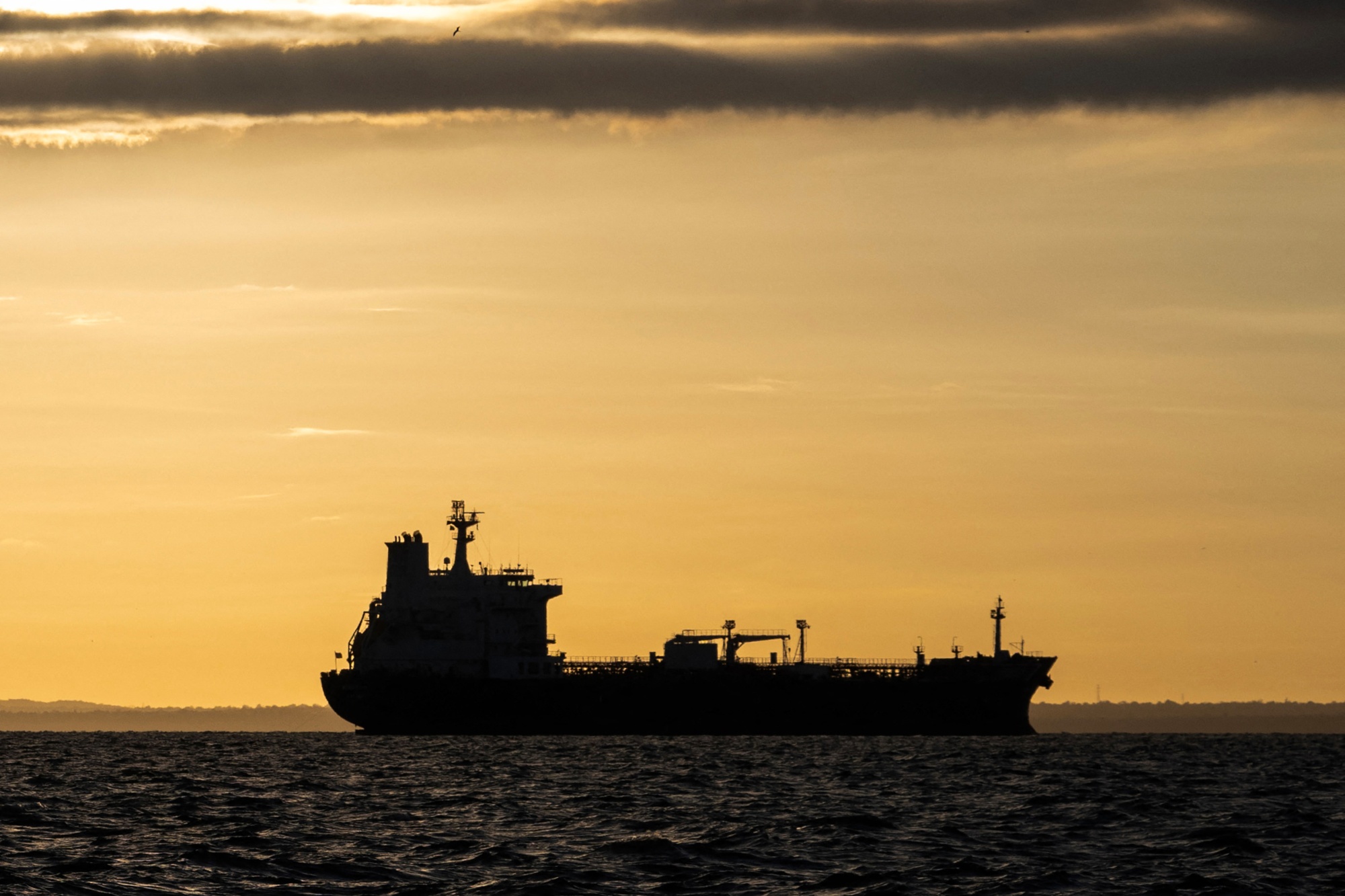 The silhouette of the Panamanian-flagged crude oil tanker Nord Star on Lake Maracaibo, in Maracaibo, Venezuela, on Jan. 7. Photographer: Maryorin Mendez/AFP