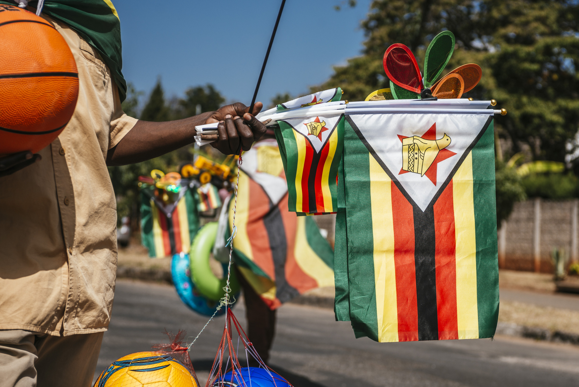A street vendor displays Zimbabwean flags for sale in Harare, Zimbabwe.