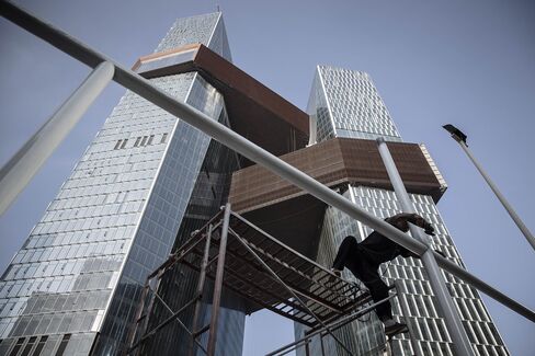 The bridges not only connect the two structures, but also house facilities, including a 300-meter running track.