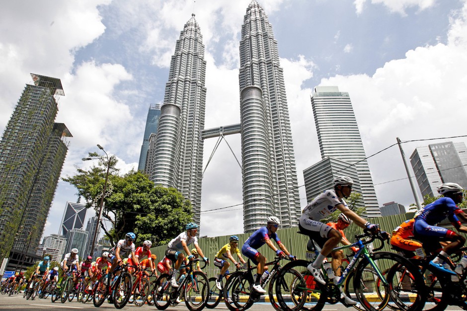 Cyclists race past the landmark Petronas Towers during the last stage of Le Tour de Langkawi in Kuala Lumpur in 2018.