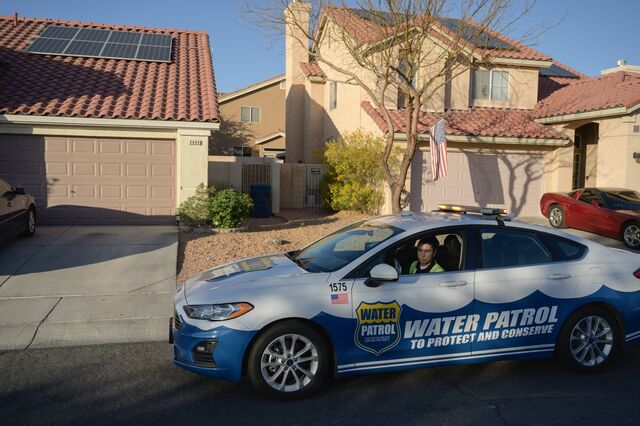 Las Vegas Valley Water District water waste investigator Cameron Donnarumma patrols a neighborhood for water violations in Las Vegas, Nevada, 2022.
