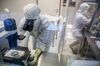 A laboratory specialist uses a microscope to check cells during the last phase of vaccine manufacture inside a clean laboratory at the Sotio AS biotechnology company in Prague, Czech Republic, on Wednesday, July 20, 2016. Czech Republic’s richest man, billionaire Petr Kellner's Sotio biotech company, which is seeking to develop active cellular immunotherapy for treatment of prostate, ovarian and lung cancer, has invested "billions of koruna" into research and clinical development, the unit's spokesman, Richard Kapsa, said without elaborating.
