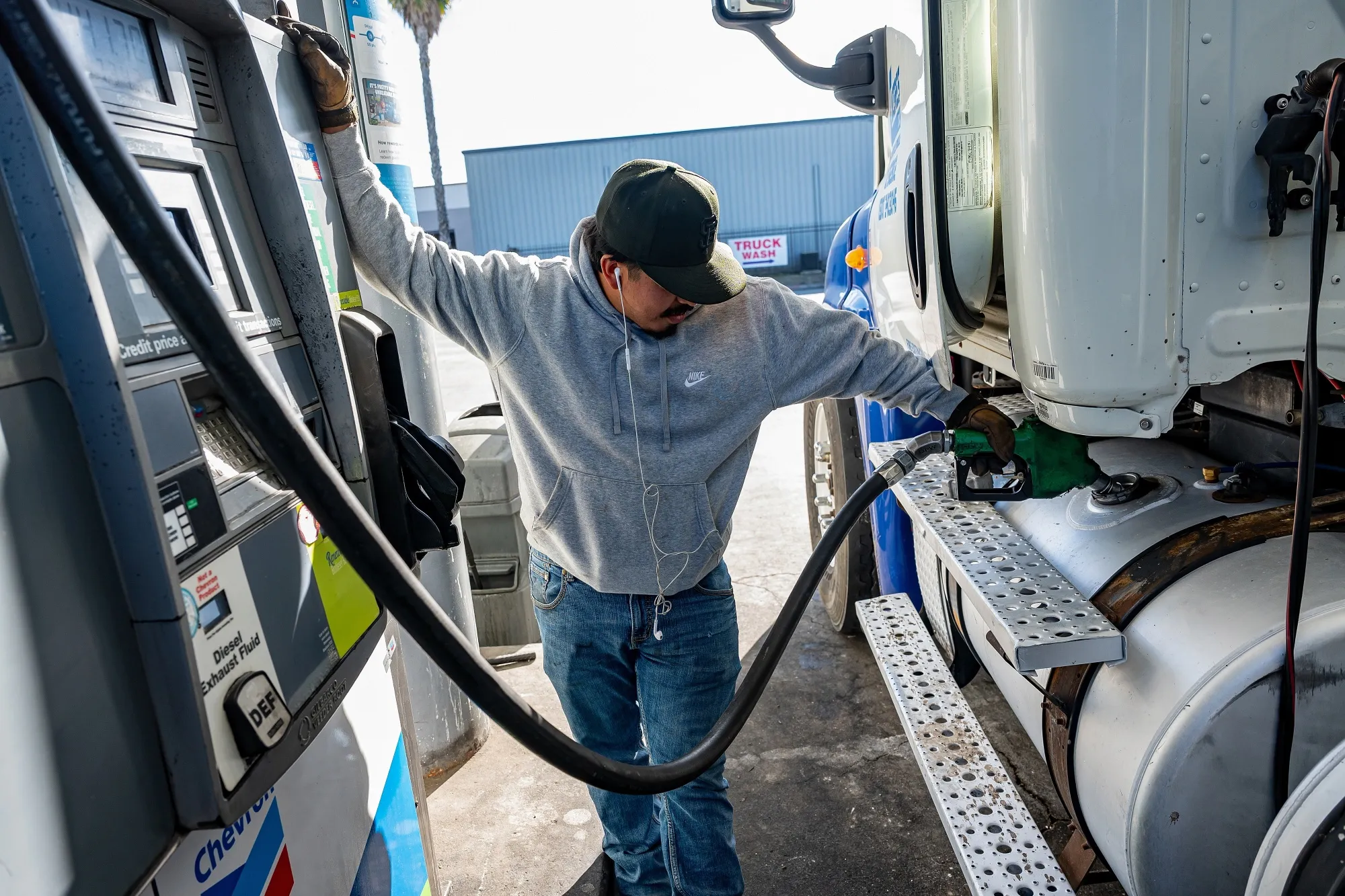 A driver refuels a tractor trailer with diesel fuel at a truck stop in Tracy, California.
