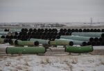Pipes for the Keystone XL pipeline stacked in a yard near Oyen, Alberta, Canada, on Jan. 26. 