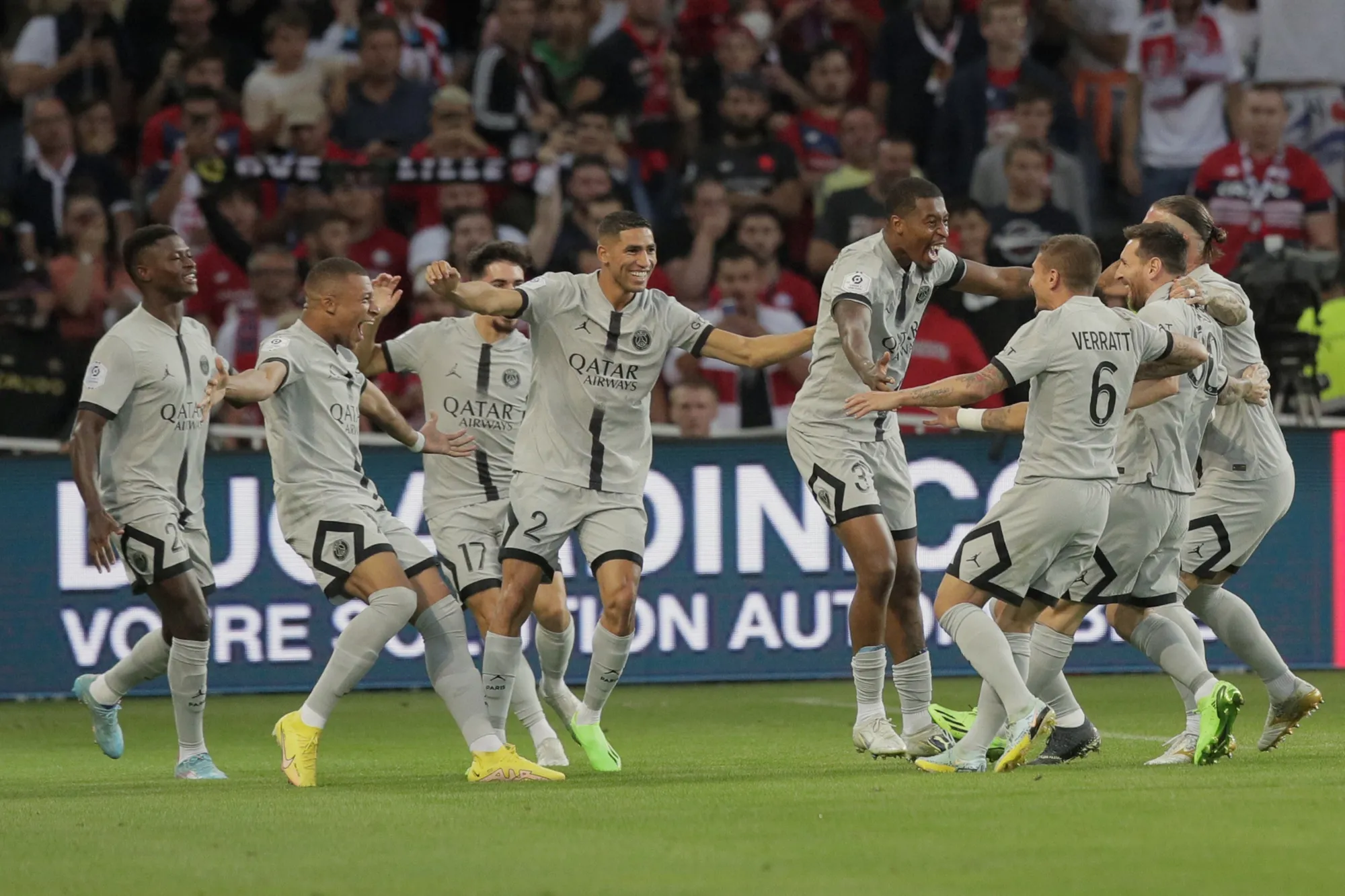 PSG's Kylian Mbappe, second left, celebrates with teammates after scoring his side first goal during the French League One soccer match between Lille and Paris Saint Germain at the Pierre Mauroy stadium in Villeneuve d'Ascq, northern France, Sunday, Aug. 21, 2022. (AP Photo/Michel Spingler)