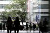 Commuters As Japan’s Wages Fall Again, Adding to Concerns Over Tax Hike