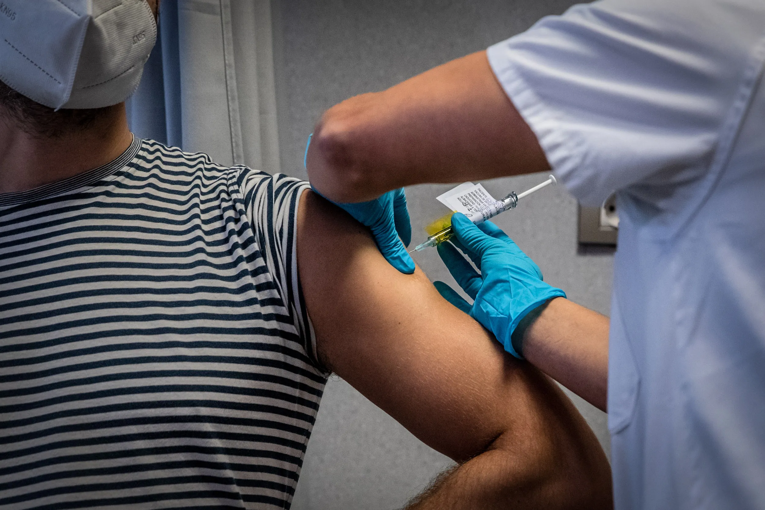 A medical worker administers an injection to a volunteer during a phase 3 trial of the Johnson &amp; Johnson Covid-19 vaccine&nbsp;in&nbsp;Barcelona, Spain, on&nbsp;Dec. 17, 2020.