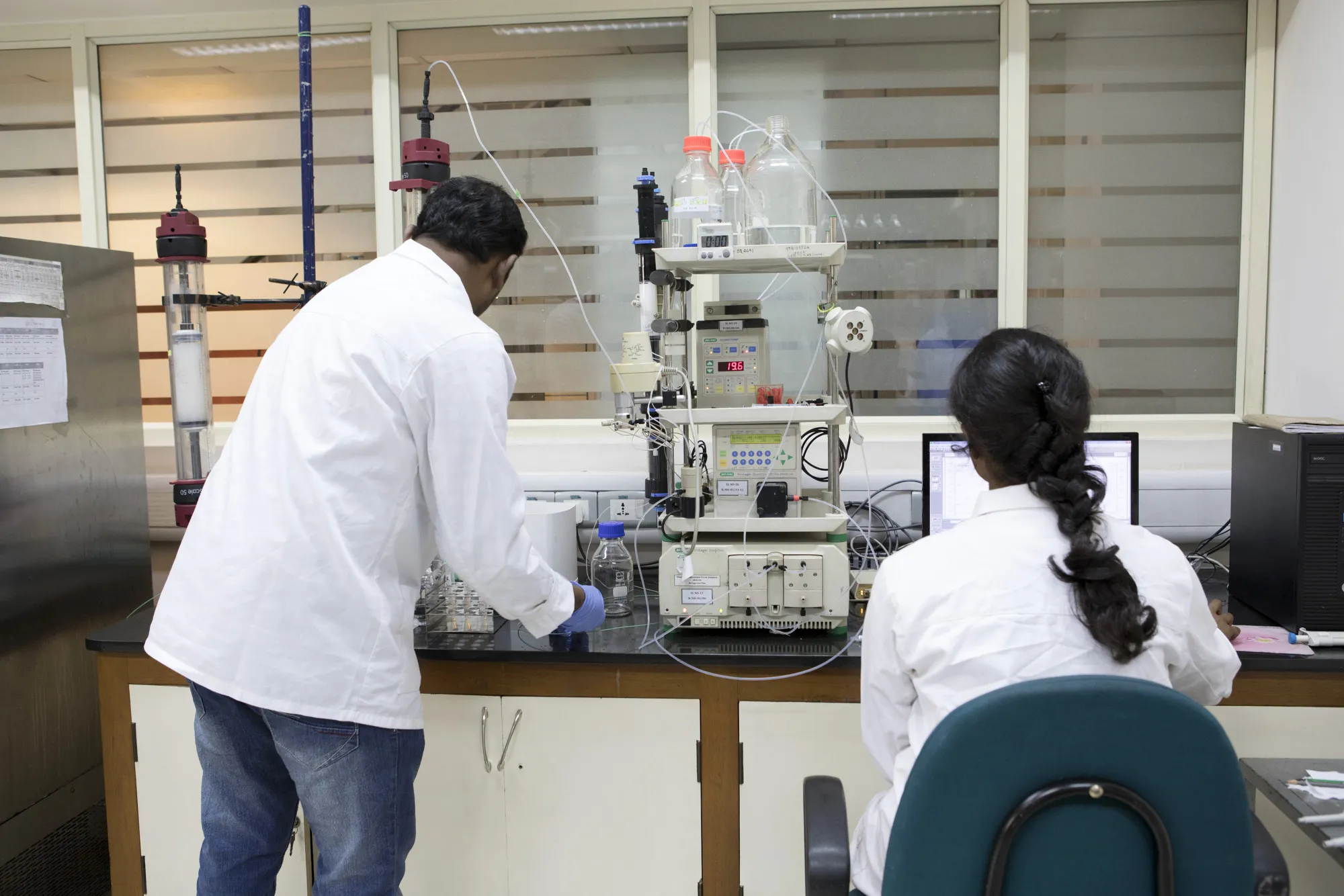 Technicians use a protein purification unit in a laboratory in Bengaluru, India.