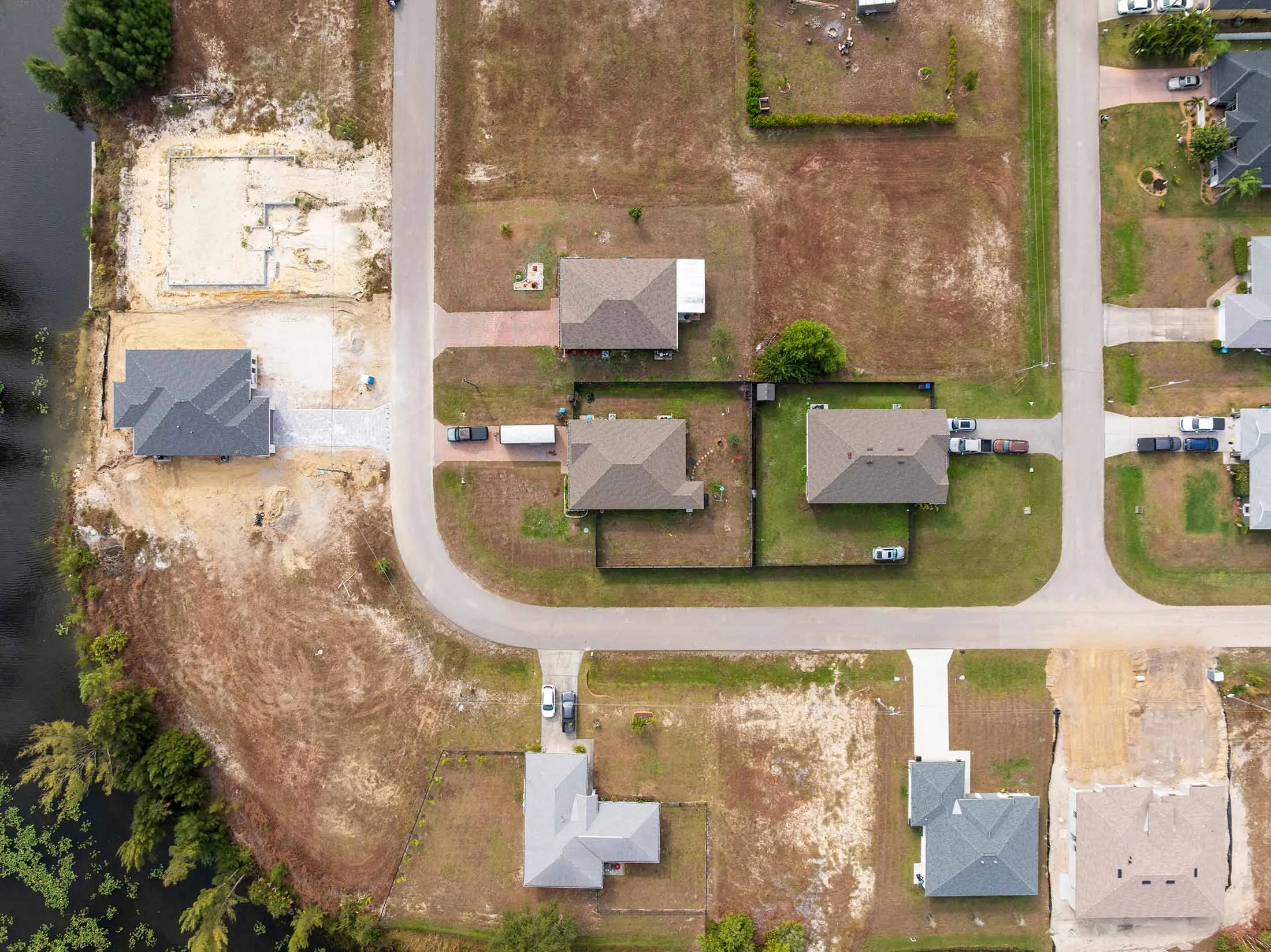 Unfinished homes dot Gator Circle, a neighborhood in Cape Coral, Florida.