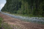 A barbed-wire barrier along the frontier with Belarus, near Krynki, Poland, on Aug. 18.