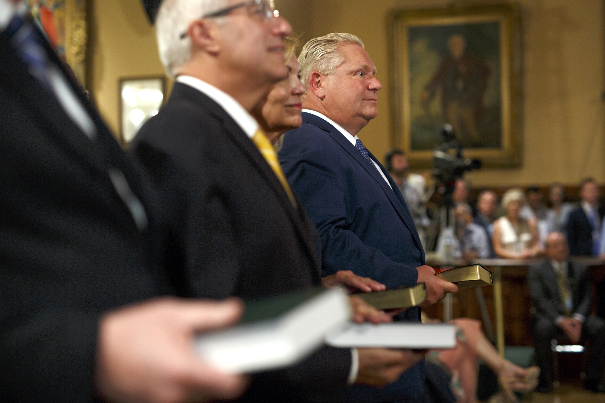 Ontario Premier Doug Ford, right, and his cabinet are sworn in at Queen’s Park in Toronto on June 29, 2018.&nbsp;