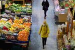 A customer shops for food&nbsp;at a market hall in Wroclaw, Poland.
