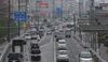 Traffic drives through a road in Toyota City, Aichi Prefecture, Japan, on Sunday, March 29, 2015. With Toyota Motor Corp. set to earn more money than all other Japanese carmakers combined, the company's hometown is seeing a surge in tax revenue.