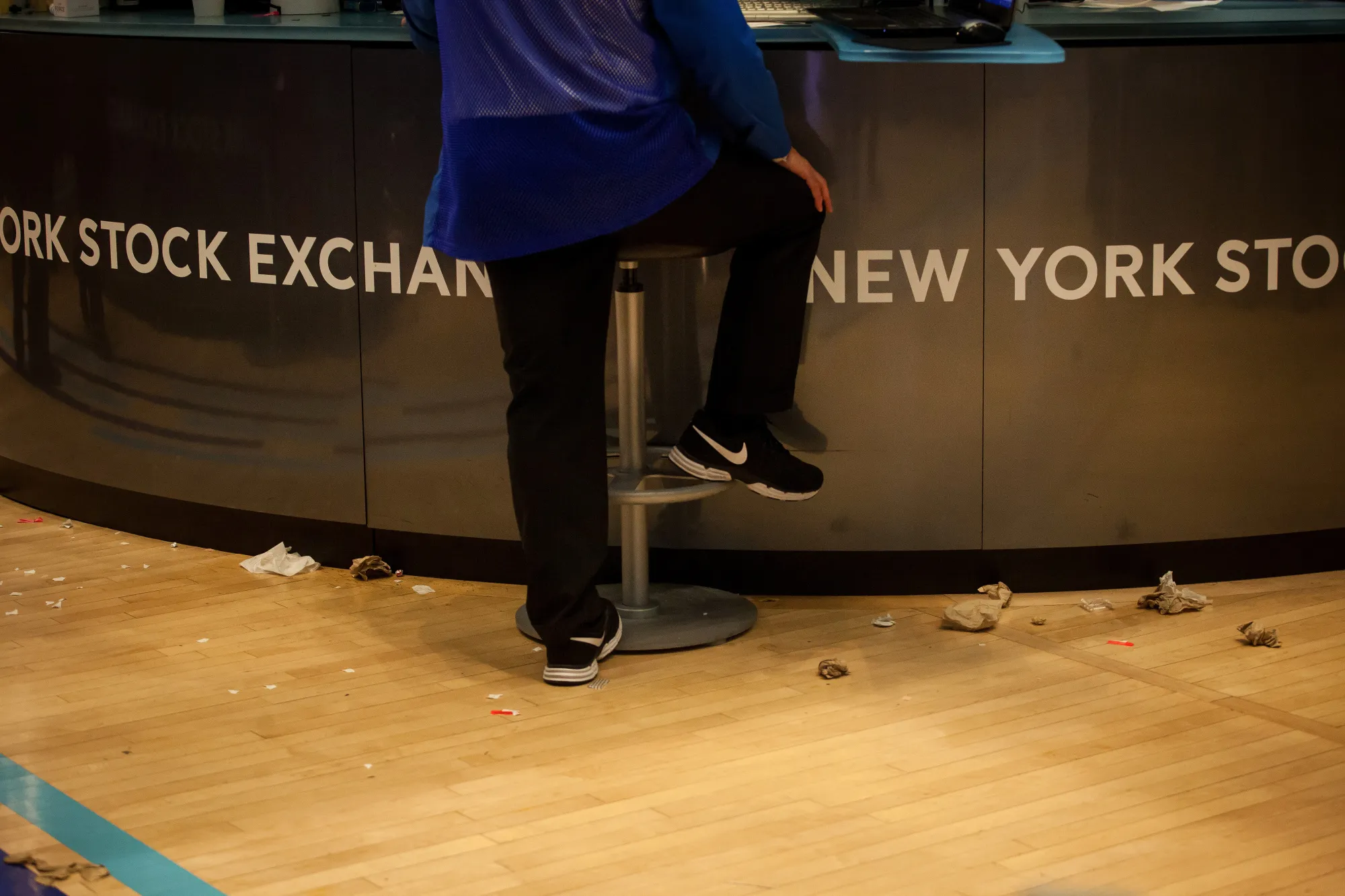A trader wearing Nike Inc. shoes works on the floor of the New York Stock Exchange (NYSE) in New York, U.S., on Friday, Sept. 29, 2017. U.S. stocks surged to all-time highs while Treasuries slumped amid reports that President Donald Trump and Treasury Secretary Steven Mnuchin met with former Federal Reserve governor Kevin Warsh to discuss the role of Fed chair.