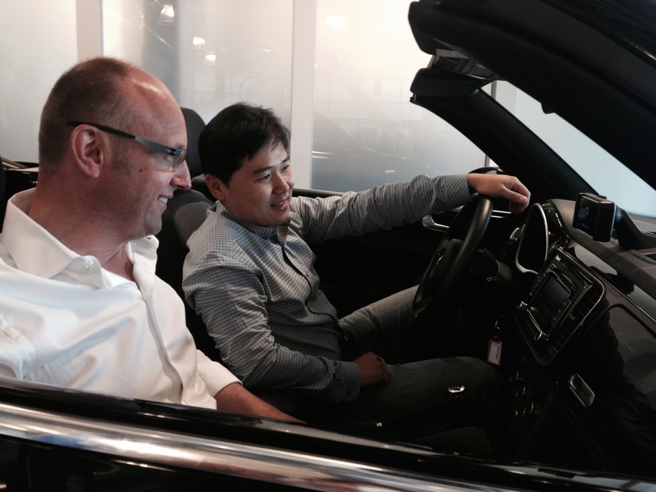 Volkswagen's Ewald Goessmann and Chuhee Lee line up a selfie at the carmaker's Electronics Research Laboratory.