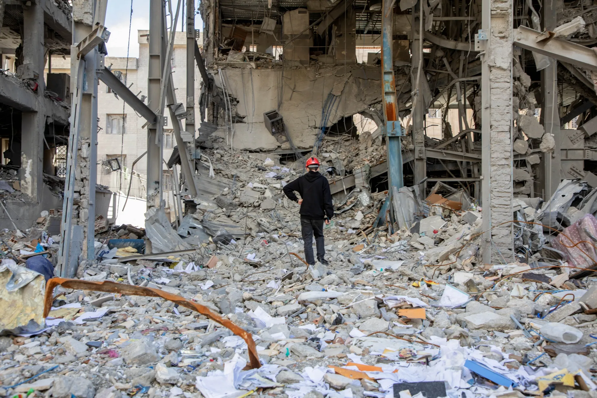 A man walks among buildings destroyed in a joint attack in Tehran, on April 6.
